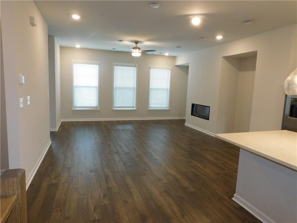 1626 Halbrook Place Southwest Marietta, GA 30008 - Photo 19 of 43 a view of an empty room with wooden floor and a window