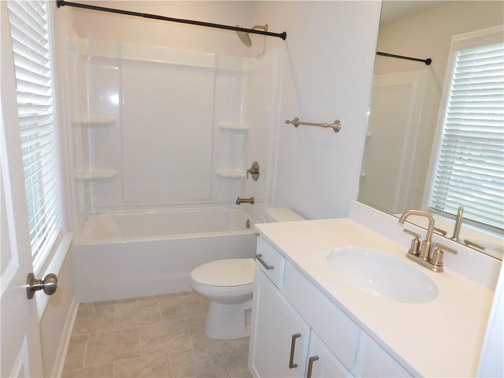 1626 Halbrook Place Southwest Marietta, GA 30008 - Photo 31 of 43 a bathroom with a sink toilet and shower