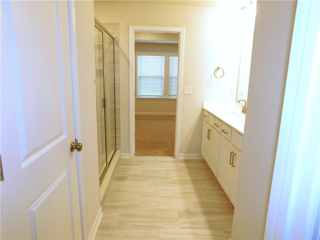 1626 Halbrook Place Southwest Marietta, GA 30008 - Photo 37 of 43 a view of a hallway with wooden floor and staircase