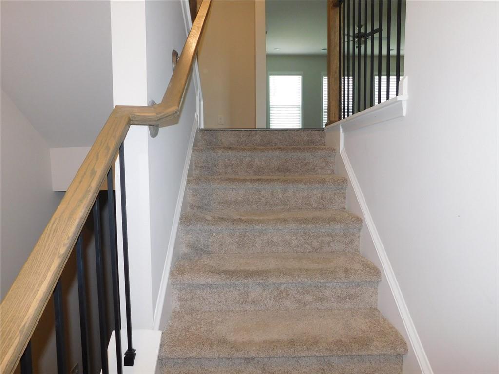 1626 Halbrook Place Southwest Marietta, GA 30008 - Photo 10 of 43 a view of staircase with lots of frames on wall