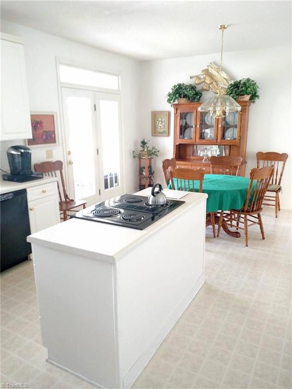 785 Carson Road Pilot Mountain, NC 27041 - Photo 22 of 30 Eat in Kitchen with rear door to the screened porch.