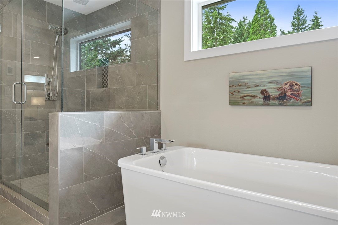 19824 86th Place West Edmonds, WA 98026 - Photo 22 of 40 a white bath tub sitting next to a shower