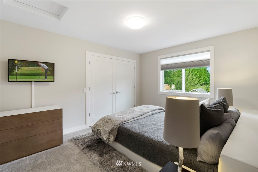 19824 86th Place West Edmonds, WA 98026 - Photo 28 of 40 a bed room with a bed window and a chair