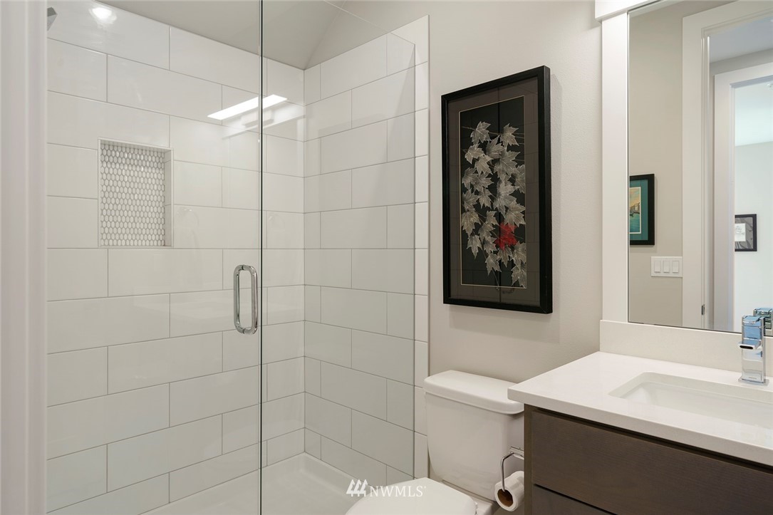 19824 86th Place West Edmonds, WA 98026 - Photo 33 of 40 a bathroom with a sink a toilet a shower and a mirror