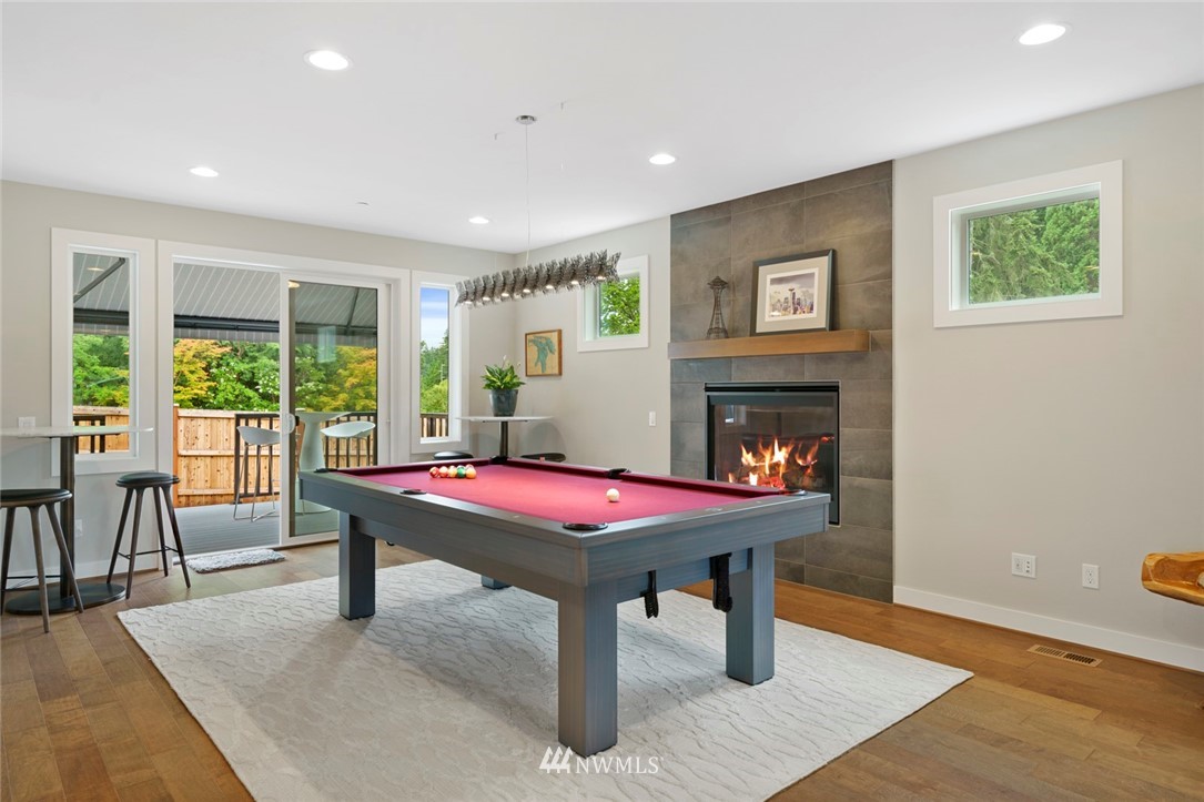 19824 86th Place West Edmonds, WA 98026 - Photo 10 of 40 a room with furniture pool table table and a fireplace