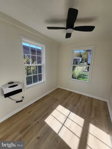 a view of an empty room and a window