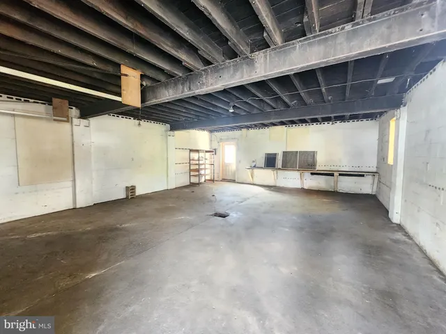 a view of empty room with cabinet