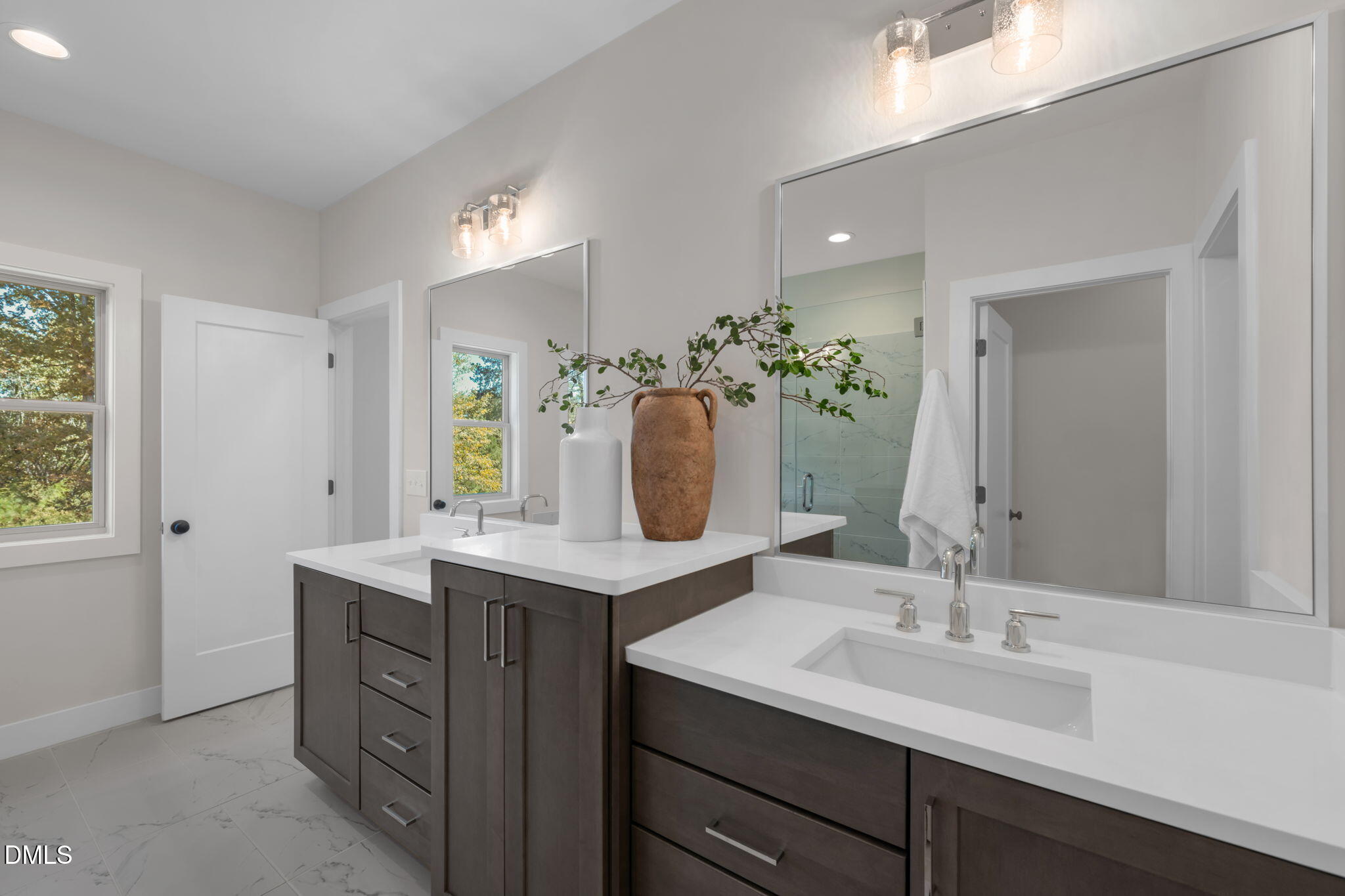 964 Double Helix Road Apex, NC 27523 - Photo 16 of 37 a bathroom with a sink double vanity granite and a mirror