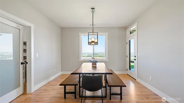a dining room with furniture and window