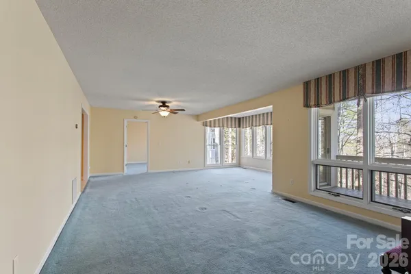 a view of an empty room with a window