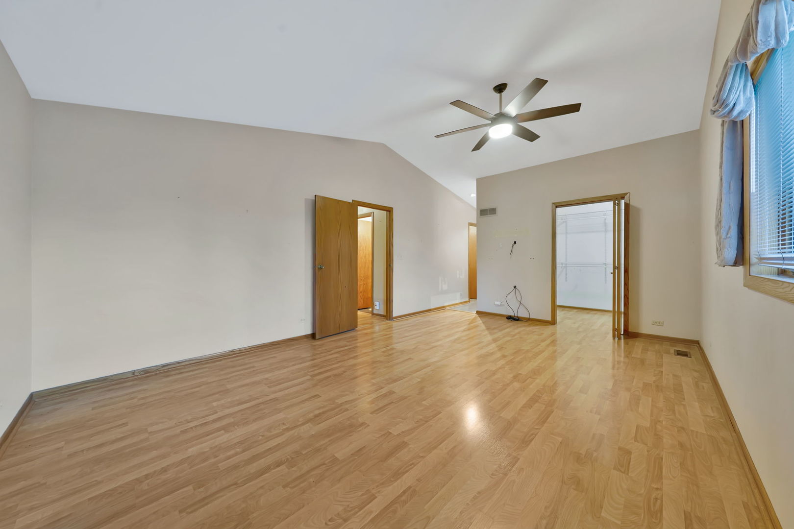 4-n040 Nugent Street Addison, IL 60101 - Photo 16 of 48 a view of an empty room with window and wooden floor