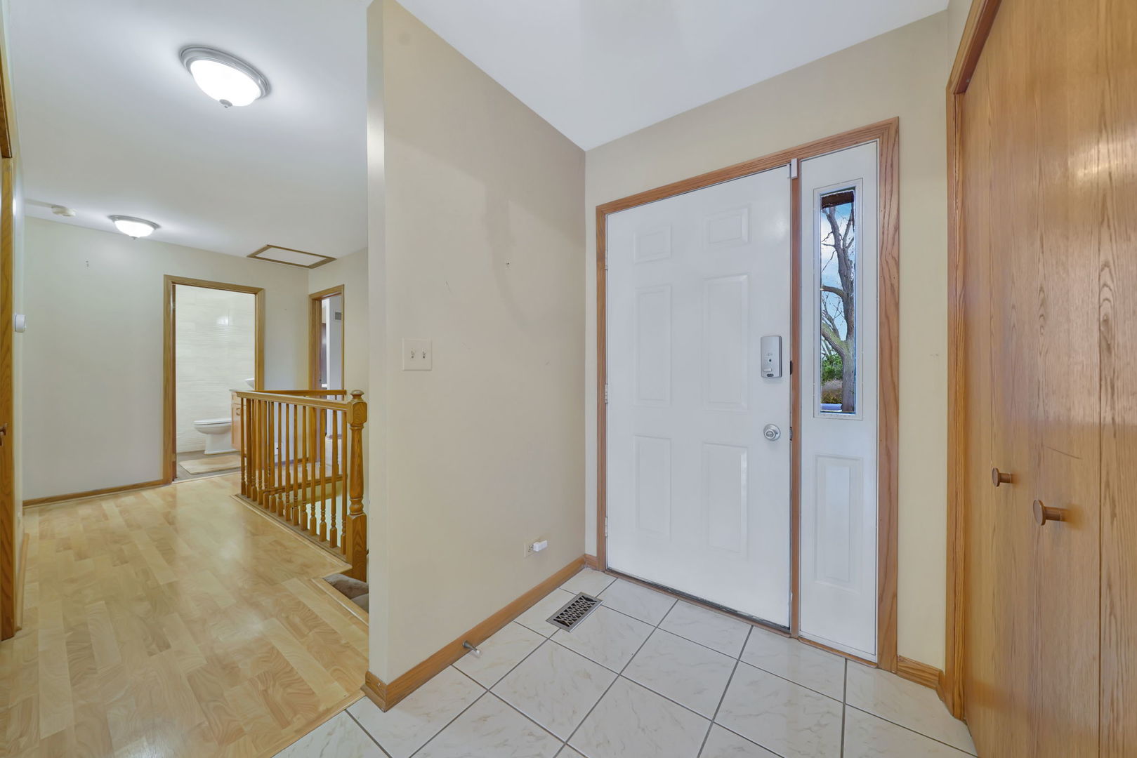 4-n040 Nugent Street Addison, IL 60101 - Photo 2 of 48 a view of a hallway with wooden floor
