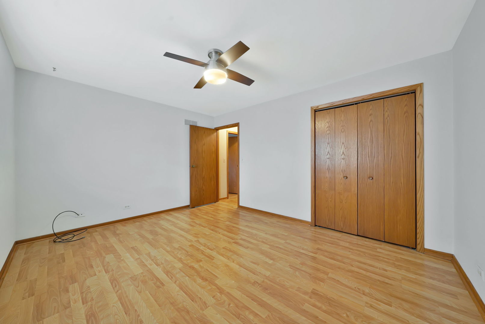 4-n040 Nugent Street Addison, IL 60101 - Photo 23 of 48 a view of an empty room and wooden floor
