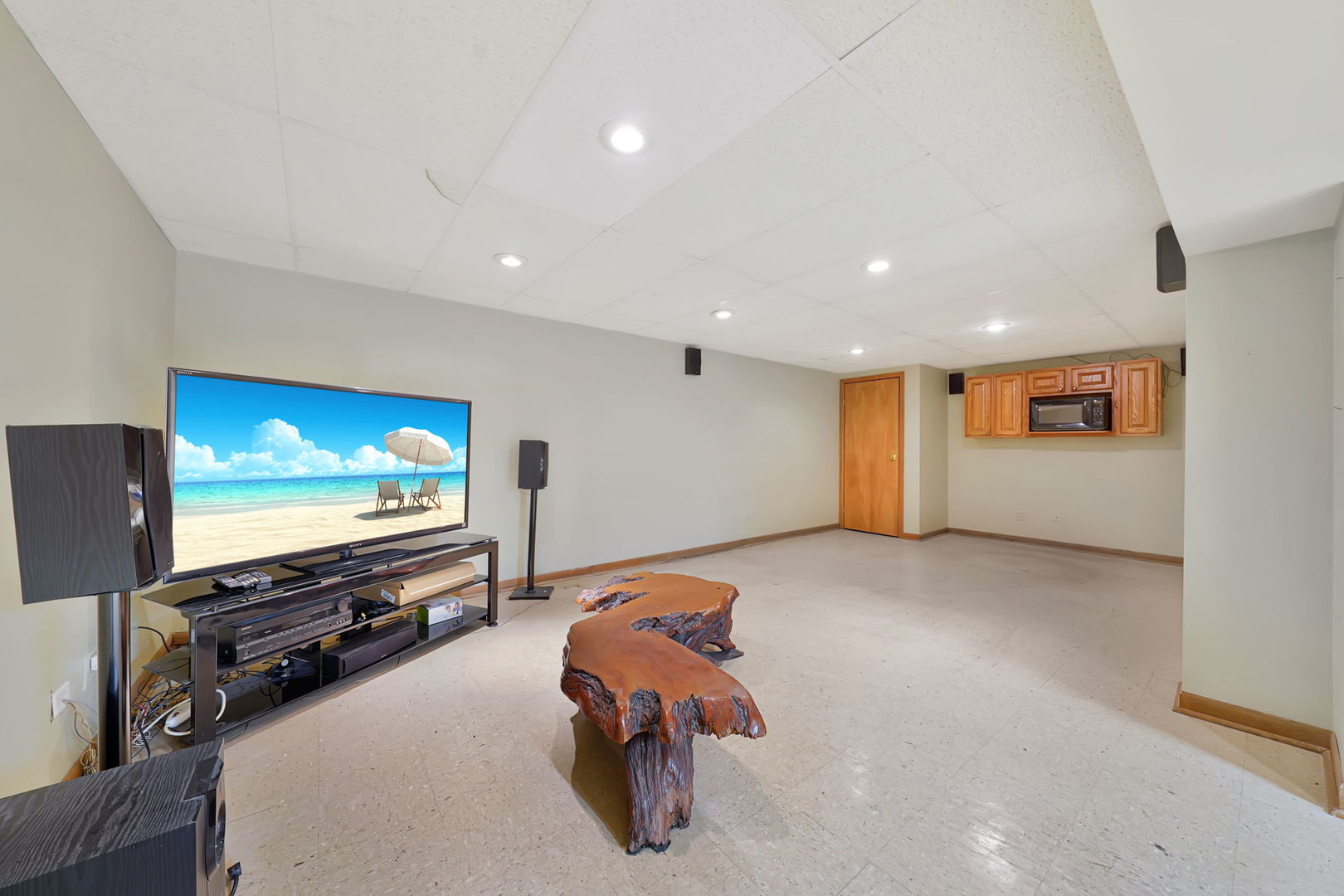 4-n040 Nugent Street Addison, IL 60101 - Photo 25 of 48 a living room with furniture and a flat screen tv