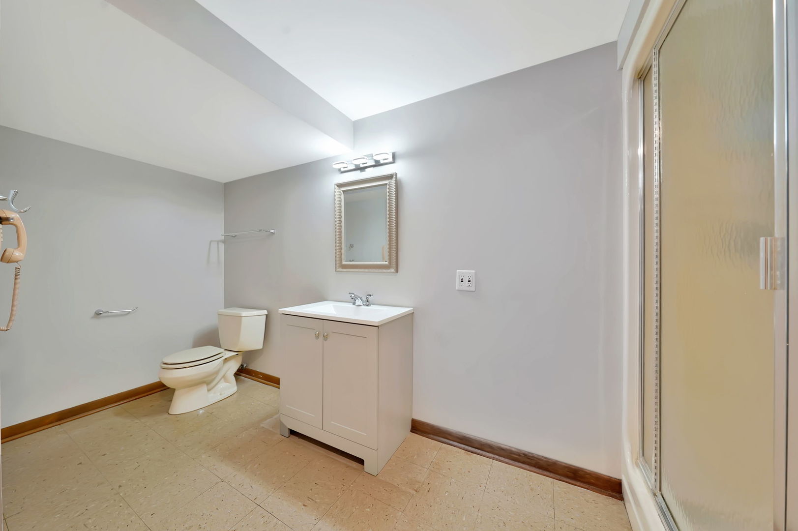 4-n040 Nugent Street Addison, IL 60101 - Photo 29 of 48 a room with a sink and a mirror