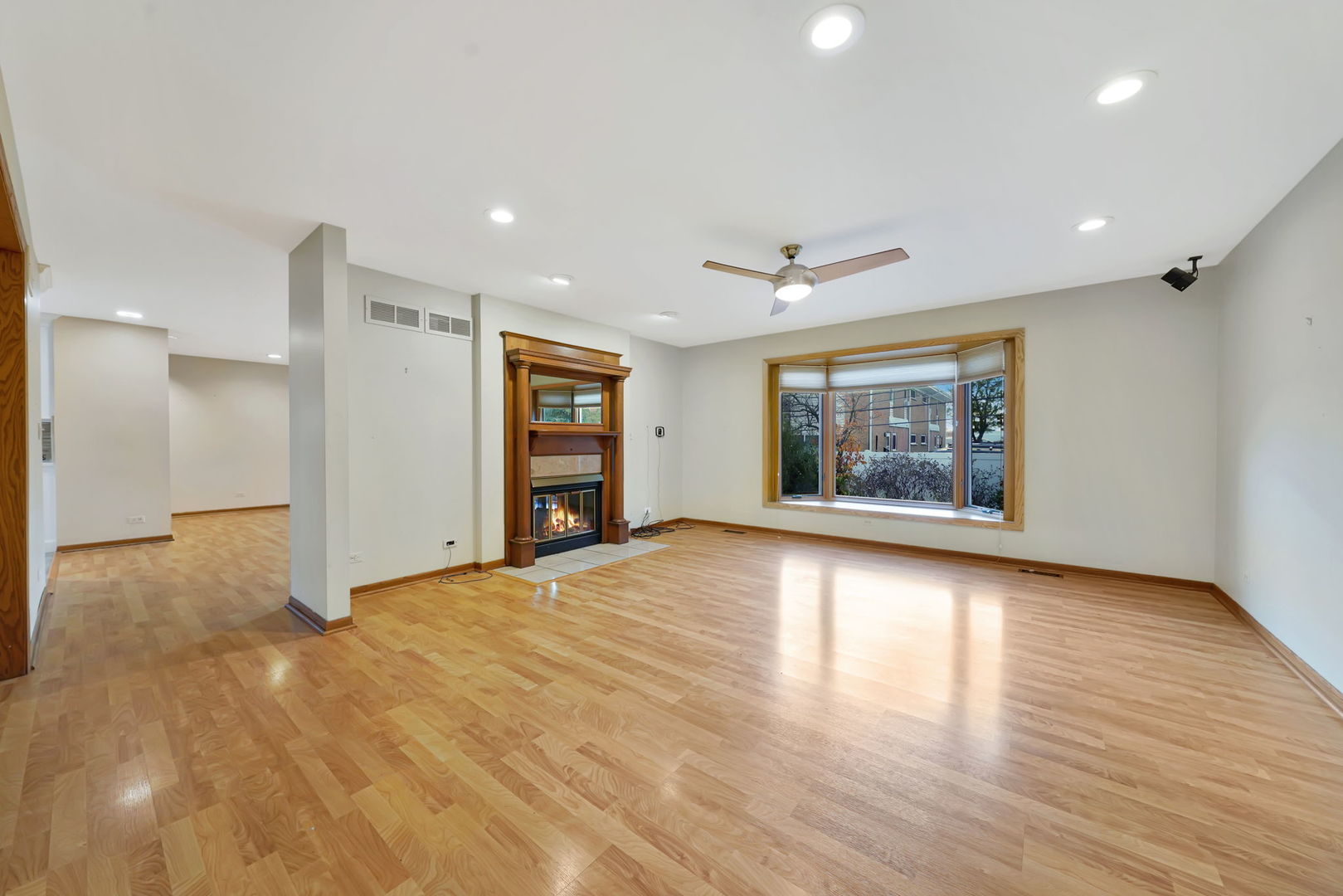 4-n040 Nugent Street Addison, IL 60101 - Photo 3 of 48 a view of an empty room with a window and wooden floor