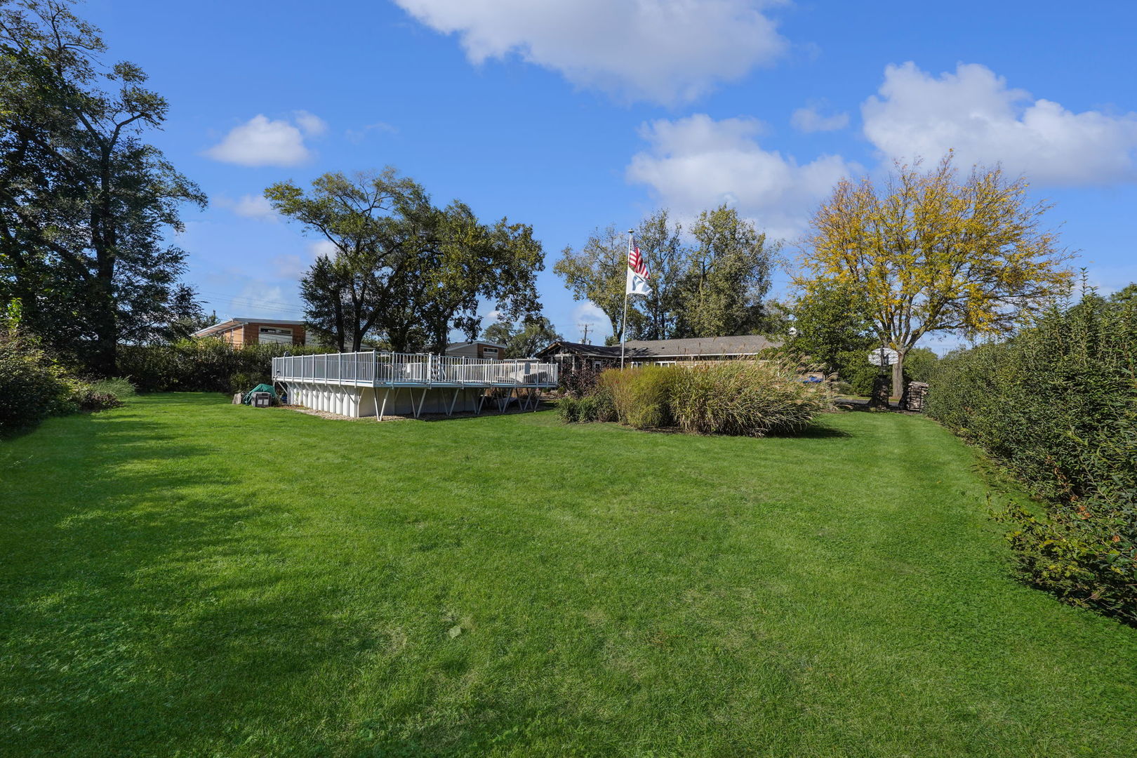 4-n040 Nugent Street Addison, IL 60101 - Photo 41 of 48 a view of a garden with a building in the background