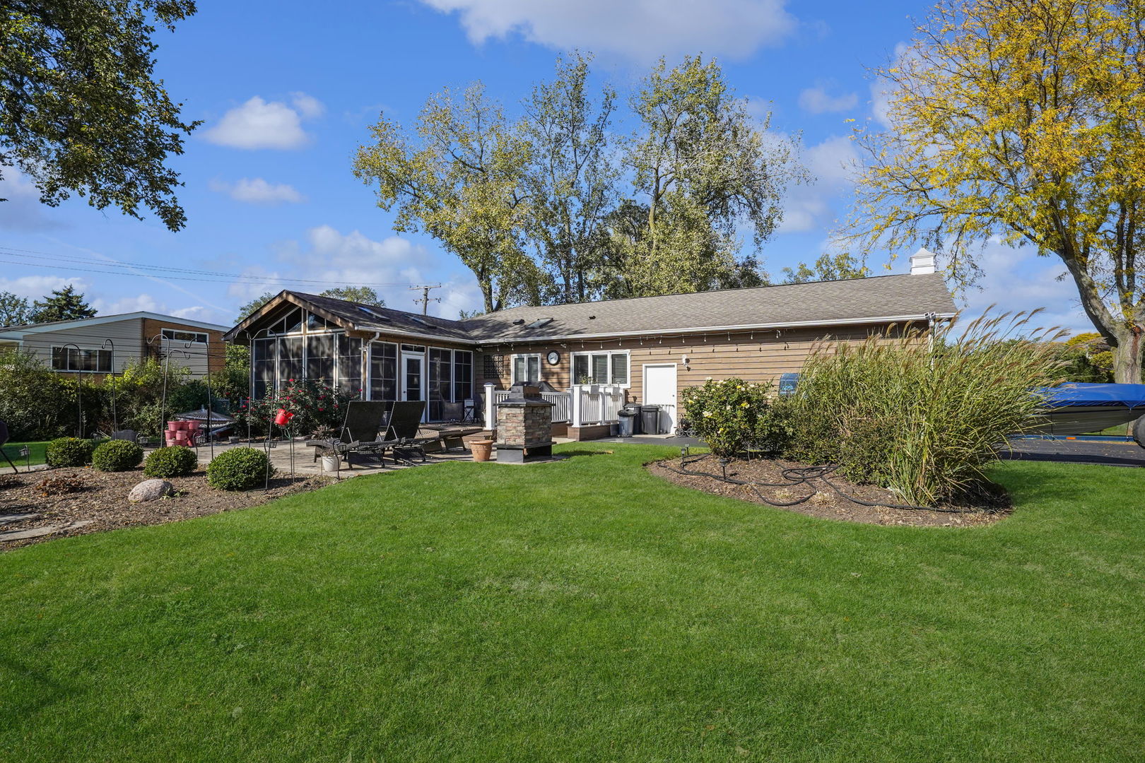 4-n040 Nugent Street Addison, IL 60101 - Photo 42 of 48 a view of a house with backyard garden and sitting area