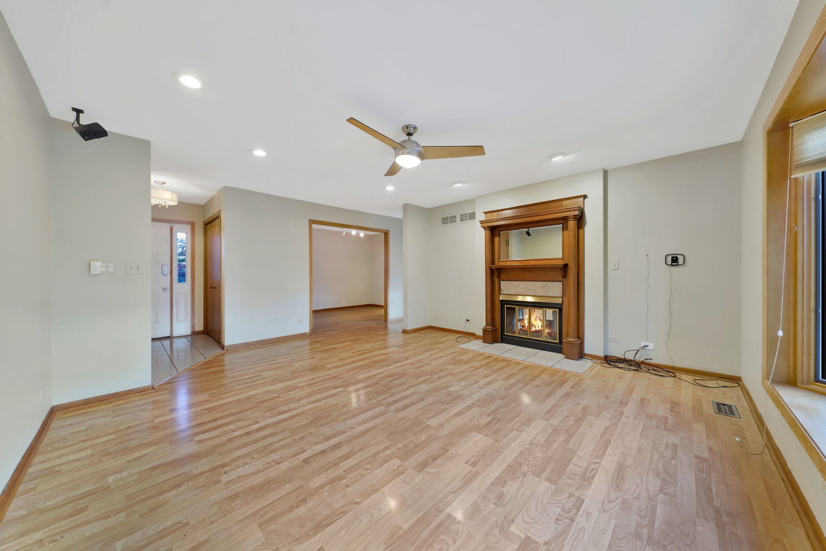 4-n040 Nugent Street Addison, IL 60101 - Photo 5 of 48 a view of an empty room with wooden floor and a window
