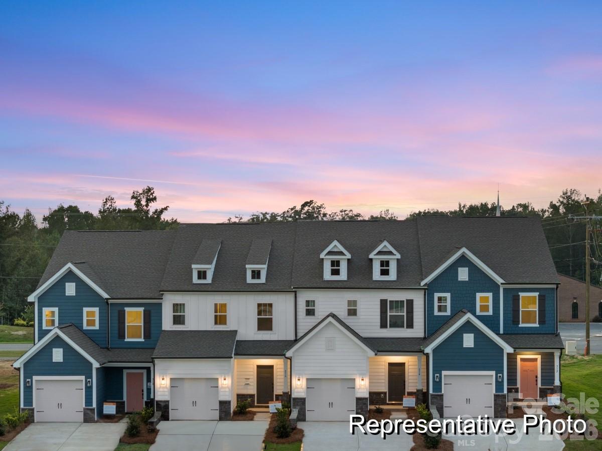325 Drawbar Drive, Unit 98 Clover, SC 29710 - Photo 1 of 17 a front view of a house with a yard