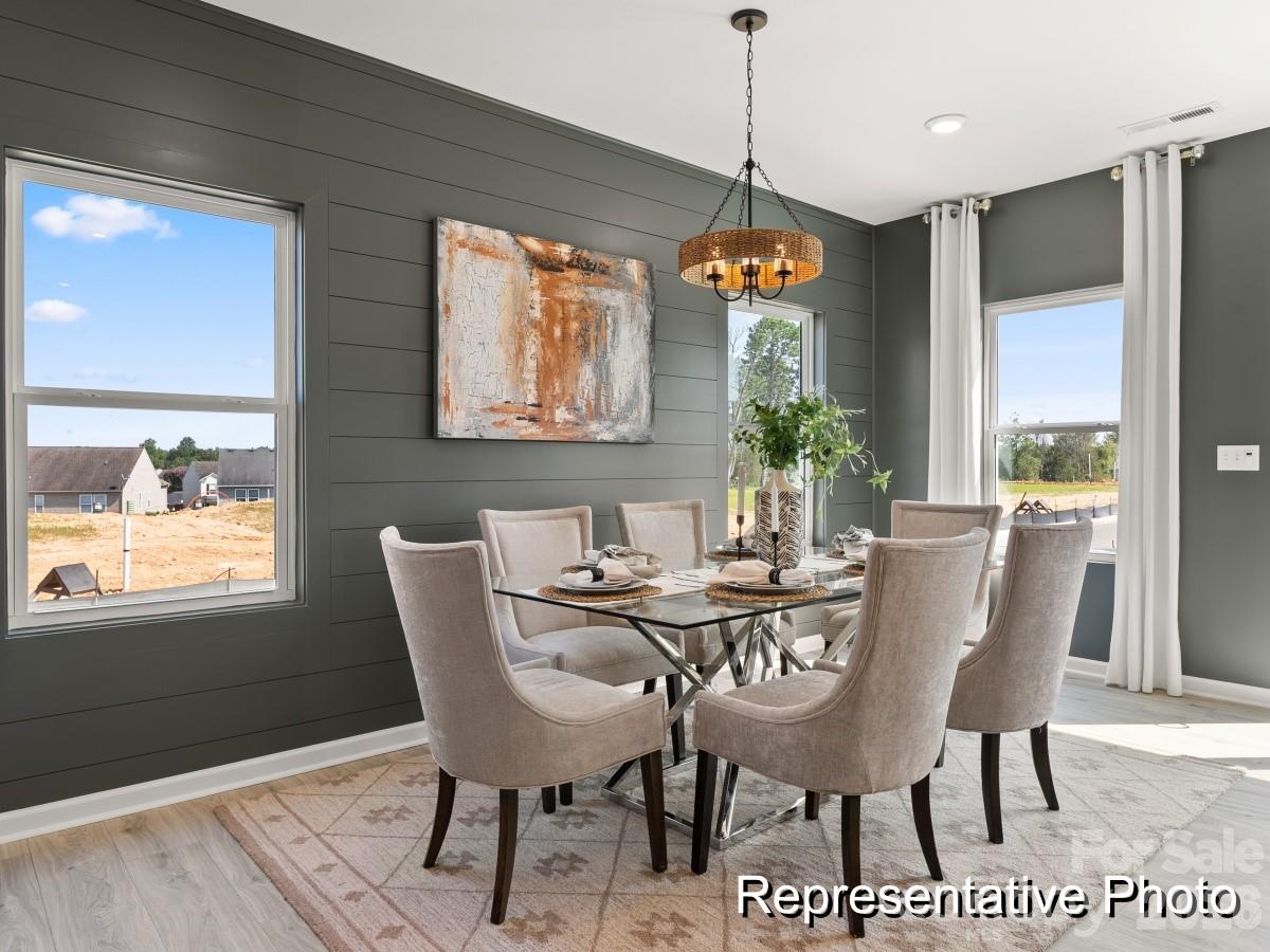 325 Drawbar Drive, Unit 98 Clover, SC 29710 - Photo 6 of 17 a view of a dining room with furniture window and outside view
