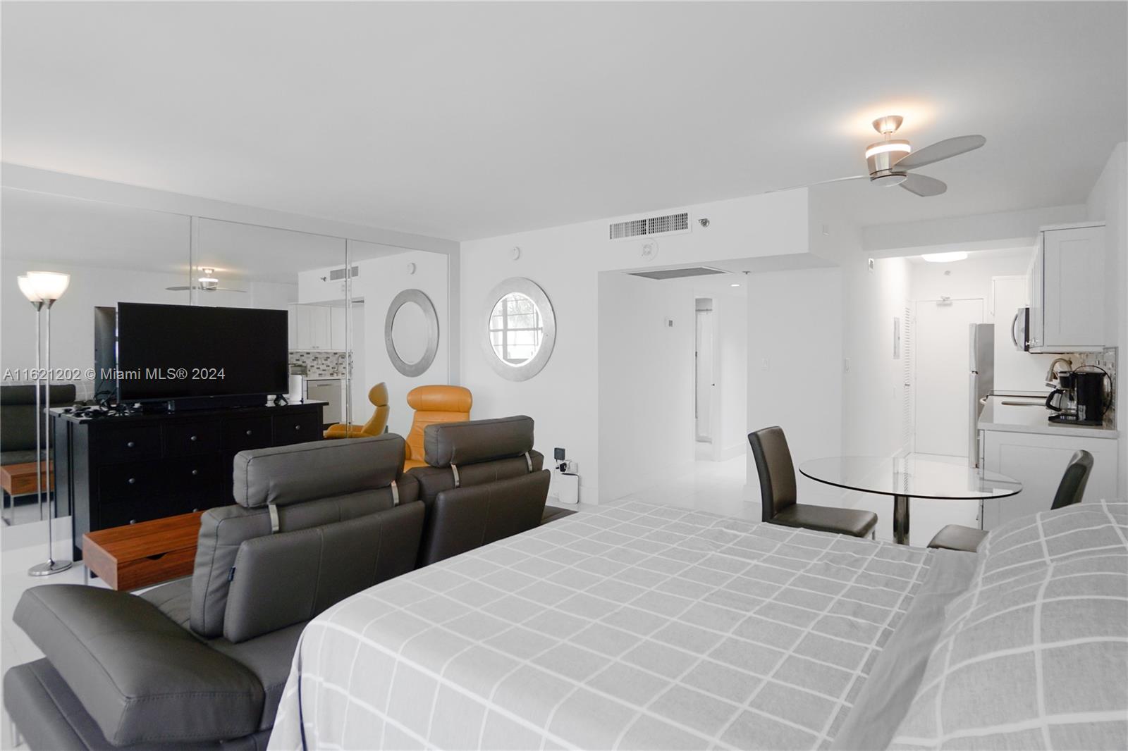 100 Lincoln Road, Unit 436 Miami Beach, FL 33139 - Photo 5 of 11 a bed room with furniture and a lamp