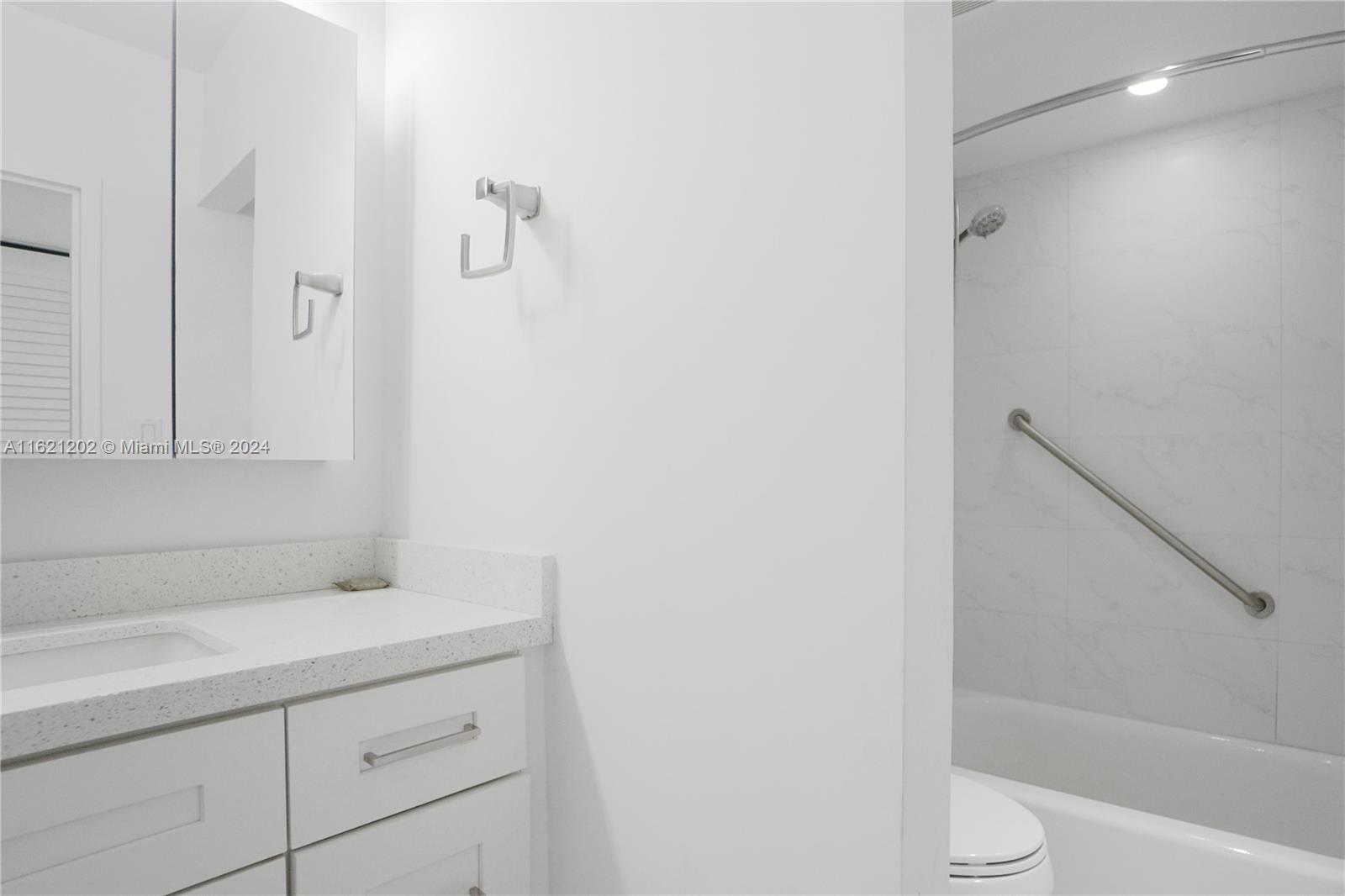 100 Lincoln Road, Unit 436 Miami Beach, FL 33139 - Photo 8 of 11 a bathroom with a sink and a vanity