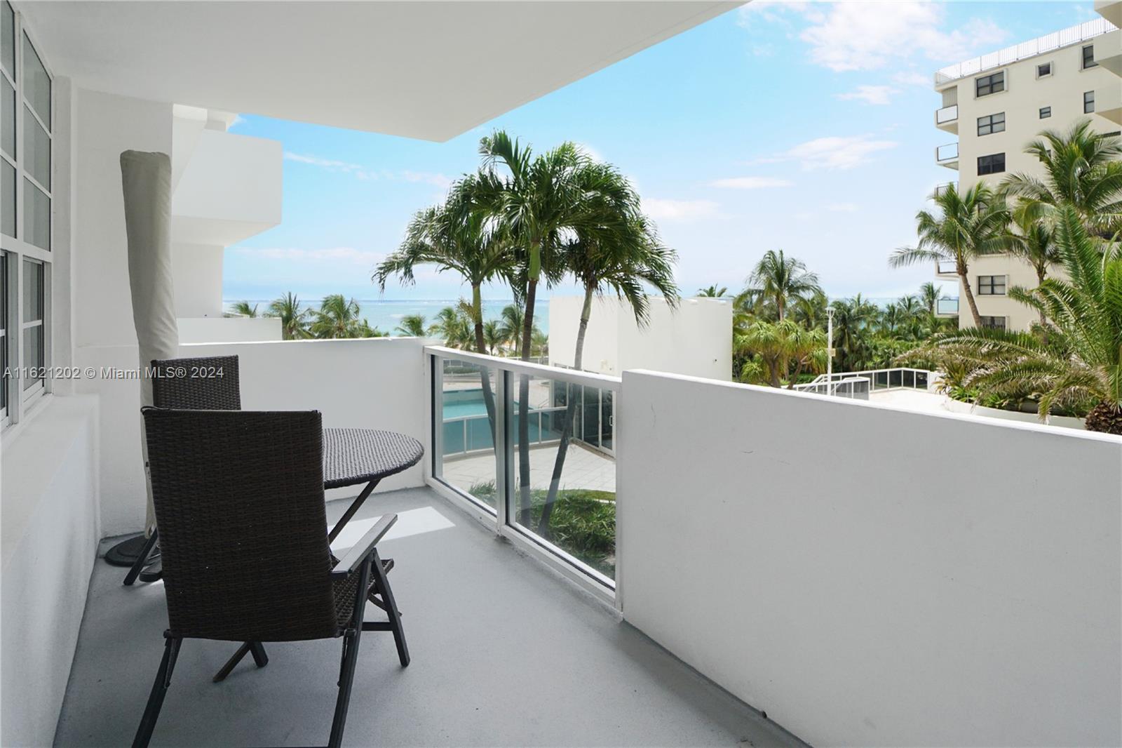 100 Lincoln Road, Unit 436 Miami Beach, FL 33139 - Photo 10 of 11 a view of a balcony with furniture and a potted plant