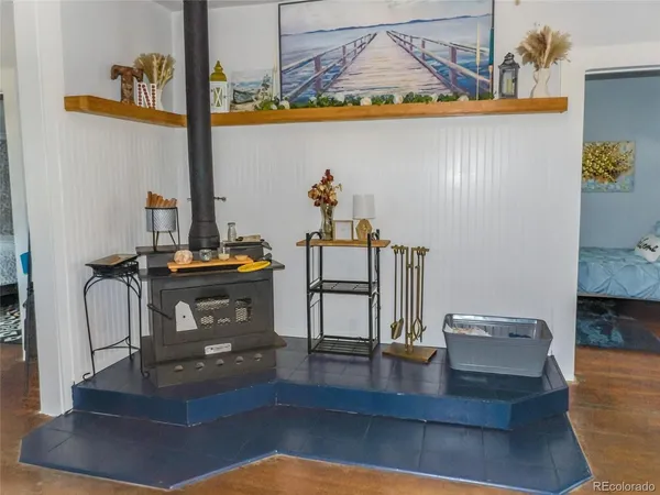 a view of living room with furniture and wooden floor