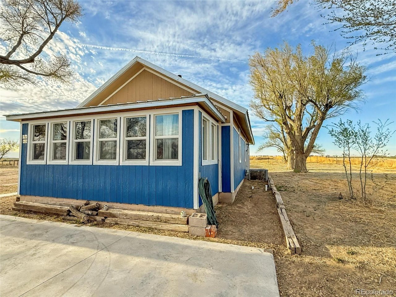 7651 State Highway Las Animas, CO 81054 - Photo 25 of 29 a view of a house with a yard