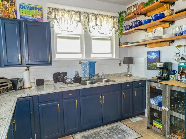 a kitchen with stainless steel appliances granite countertop wooden cabinets a sink and dishwasher