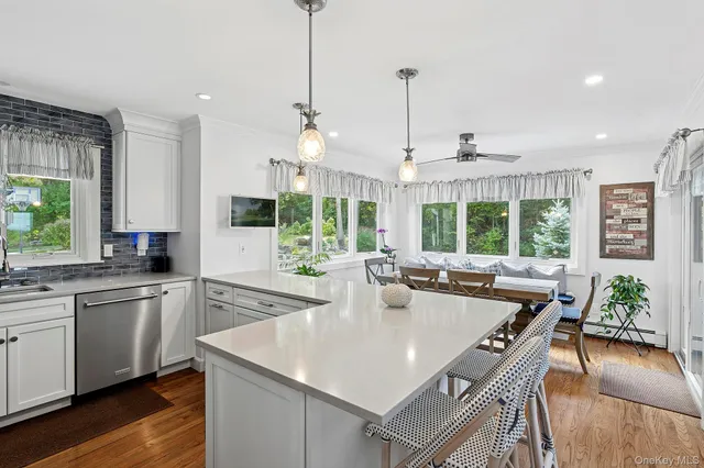 a kitchen with stainless steel appliances granite countertop counter space a sink and cabinets