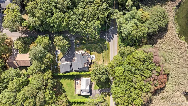 a view of a house with a yard and garden