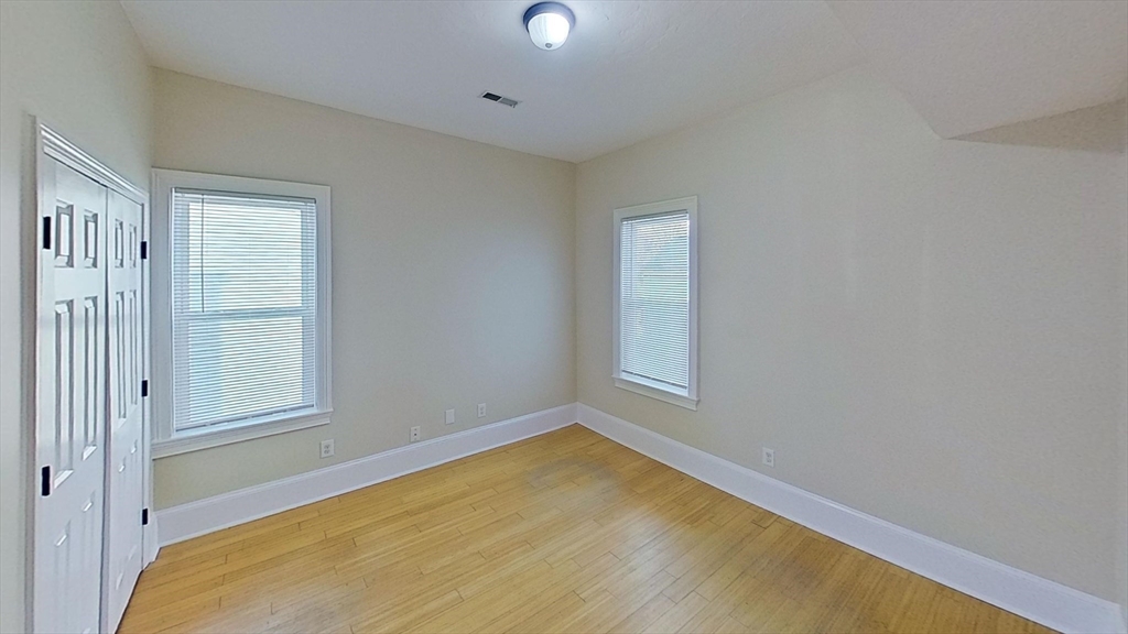 9 Landor Road, Unit 3 Boston, MA 02126 - Photo 6 of 7 an empty room with windows