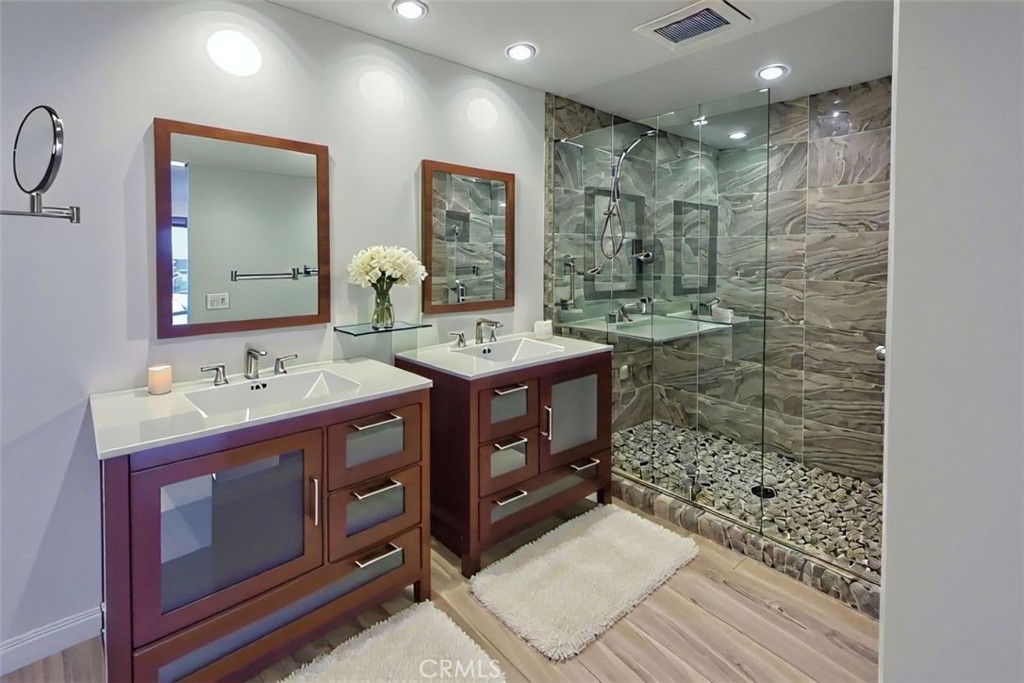 48 Oak Tree Drive Rancho Mirage, CA 92270 - Photo 11 of 31 a bathroom with a sink a mirror and a shower