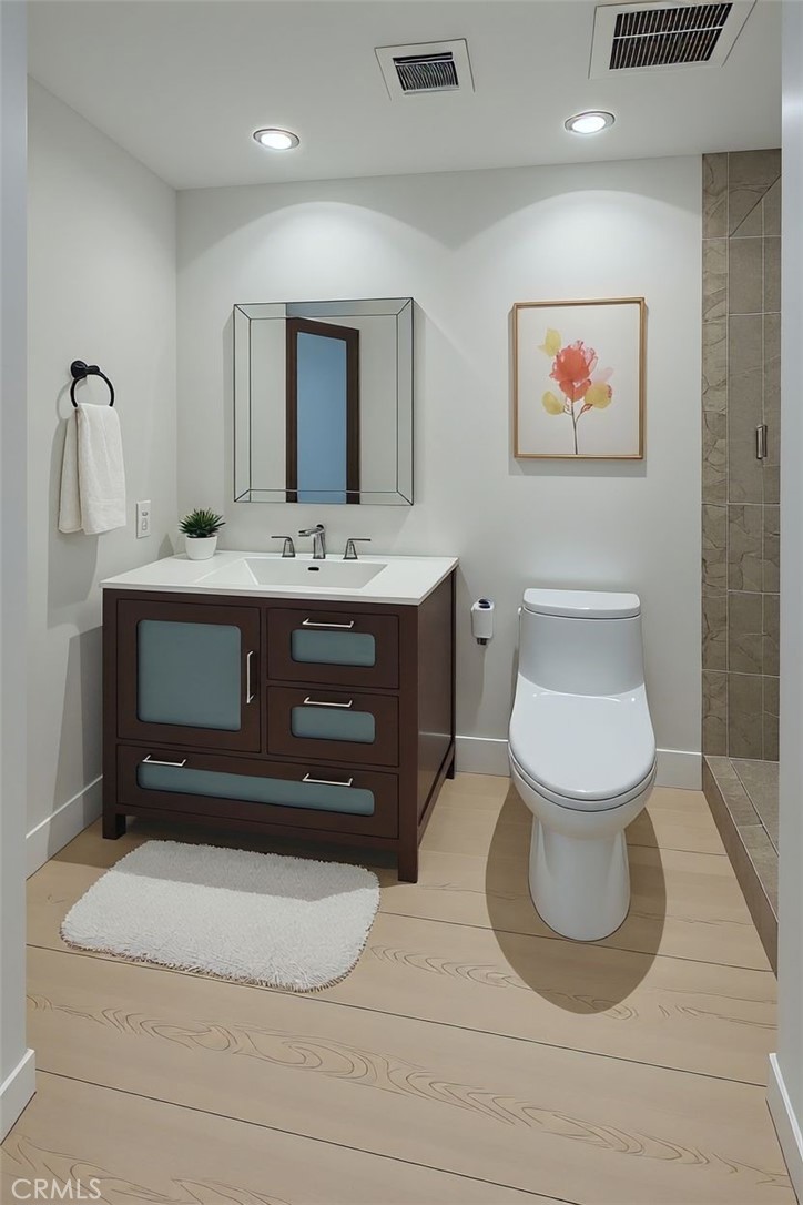 48 Oak Tree Drive Rancho Mirage, CA 92270 - Photo 14 of 31 a bathroom with a toilet sink and mirror