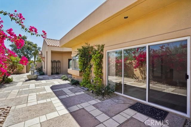 48 Oak Tree Drive Rancho Mirage, CA 92270 - Photo 18 of 31 a front view of house with yard