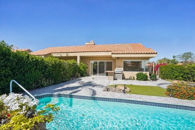 48 Oak Tree Drive Rancho Mirage, CA 92270 - Photo 25 of 31 a view of a house with backyard and sitting area