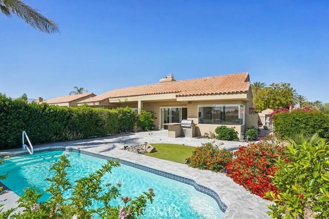 48 Oak Tree Drive Rancho Mirage, CA 92270 - Photo 26 of 31 a front view of house with yard and outdoor seating