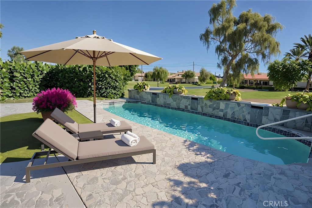 48 Oak Tree Drive Rancho Mirage, CA 92270 - Photo 6 of 31 a garden view with a seating space