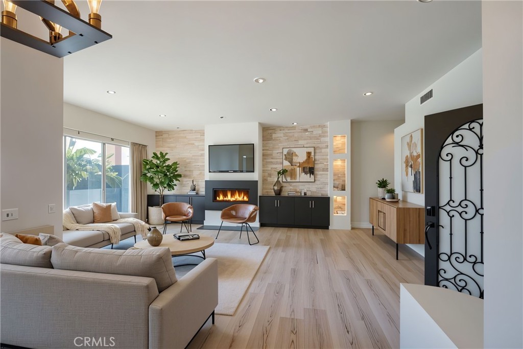 48 Oak Tree Drive Rancho Mirage, CA 92270 - Photo 7 of 31 a living room with furniture fireplace and flat screen tv