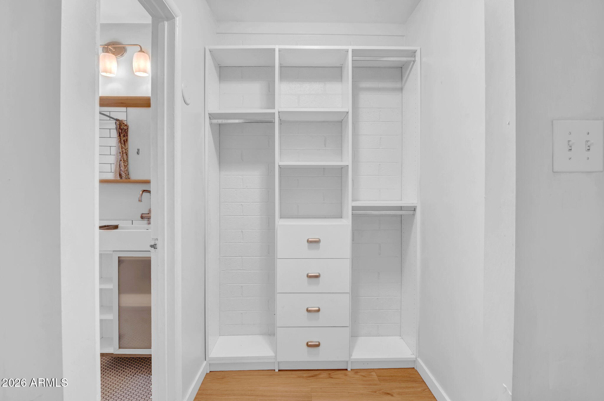 821 North 3rd Street, Unit 3 Phoenix, AZ 85004 - Photo 5 of 10 a view of walk in closet with empty racks