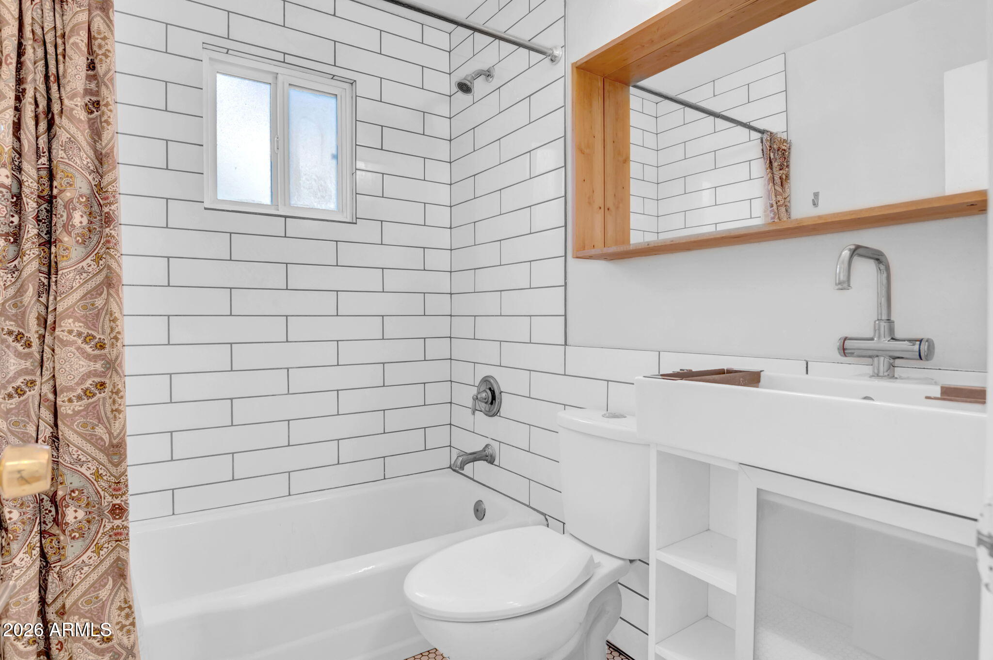 821 North 3rd Street, Unit 3 Phoenix, AZ 85004 - Photo 6 of 10 a bathroom with a sink toilet and shower
