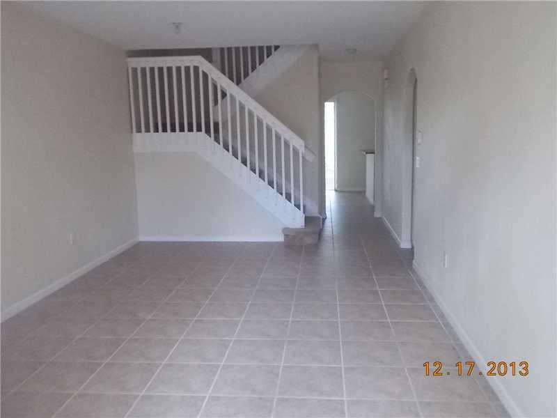 2650 Southwest 84th Terrace, Unit 105 Miramar, FL 33025 - Photo 4 of 12 a view of a hallway with stairs
