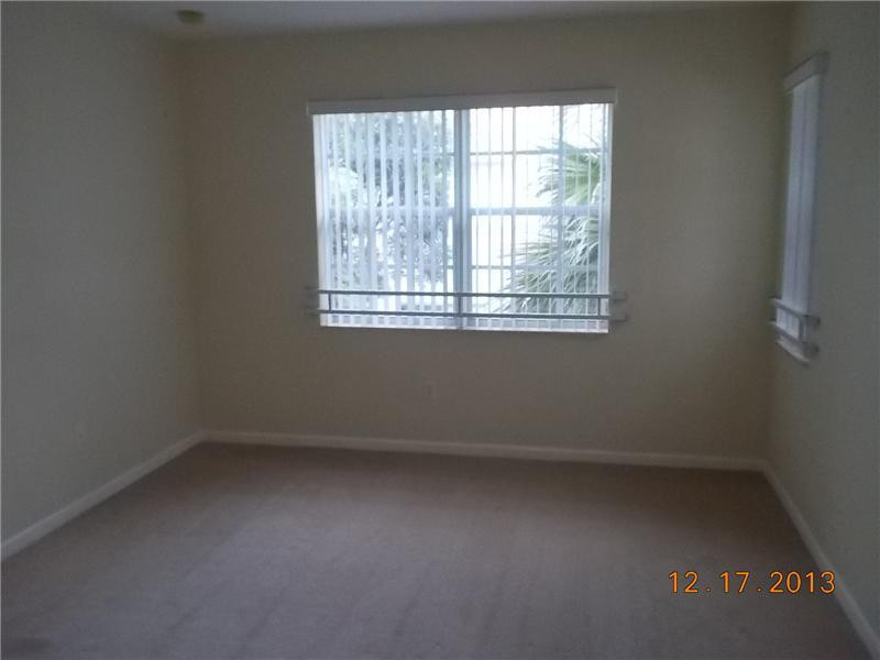 2650 Southwest 84th Terrace, Unit 105 Miramar, FL 33025 - Photo 6 of 12 an empty room with a window