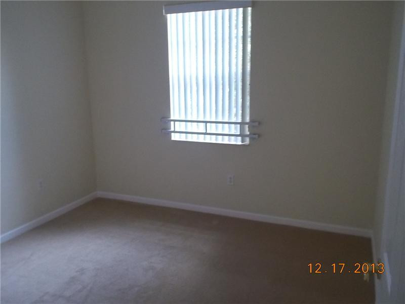2650 Southwest 84th Terrace, Unit 105 Miramar, FL 33025 - Photo 7 of 12 an empty room with a window