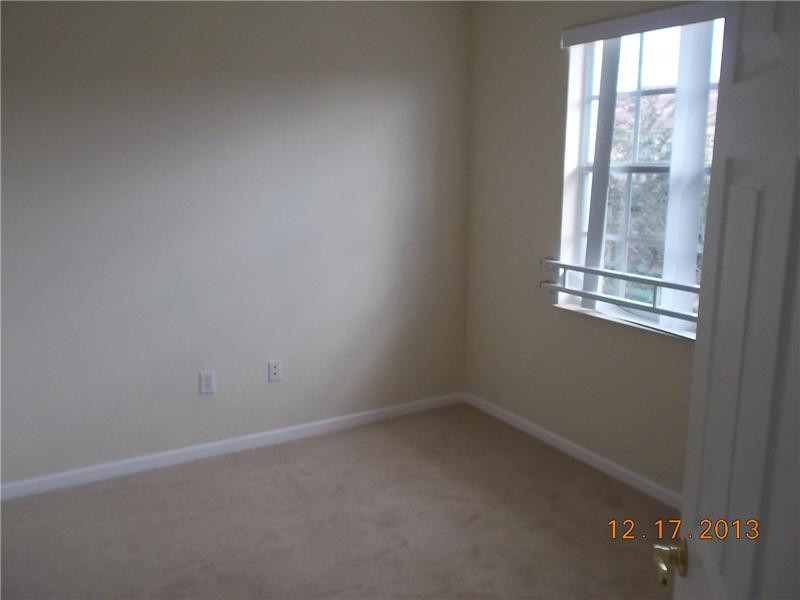 2650 Southwest 84th Terrace, Unit 105 Miramar, FL 33025 - Photo 9 of 12 an empty room with a window