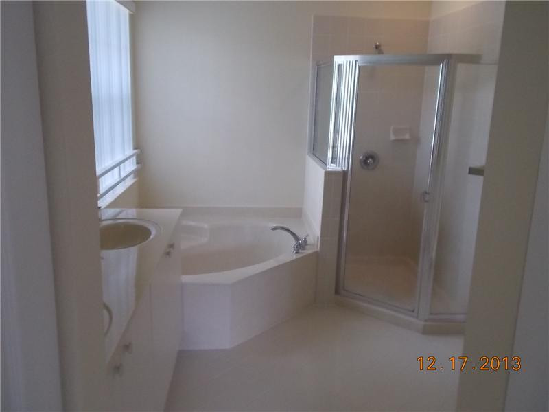 2650 Southwest 84th Terrace, Unit 105 Miramar, FL 33025 - Photo 10 of 12 a bathroom with a bathtub