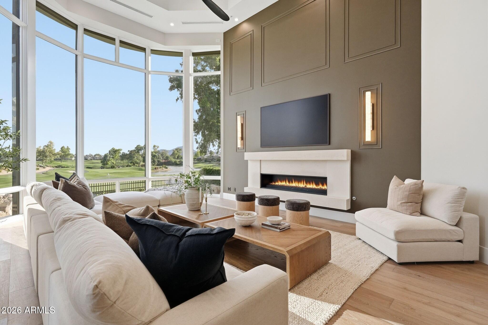 7475 East Gainey Ranch Road, Unit 7 Scottsdale, AZ 85258 - Photo 18 of 77 a living room with furniture fireplace and a large window