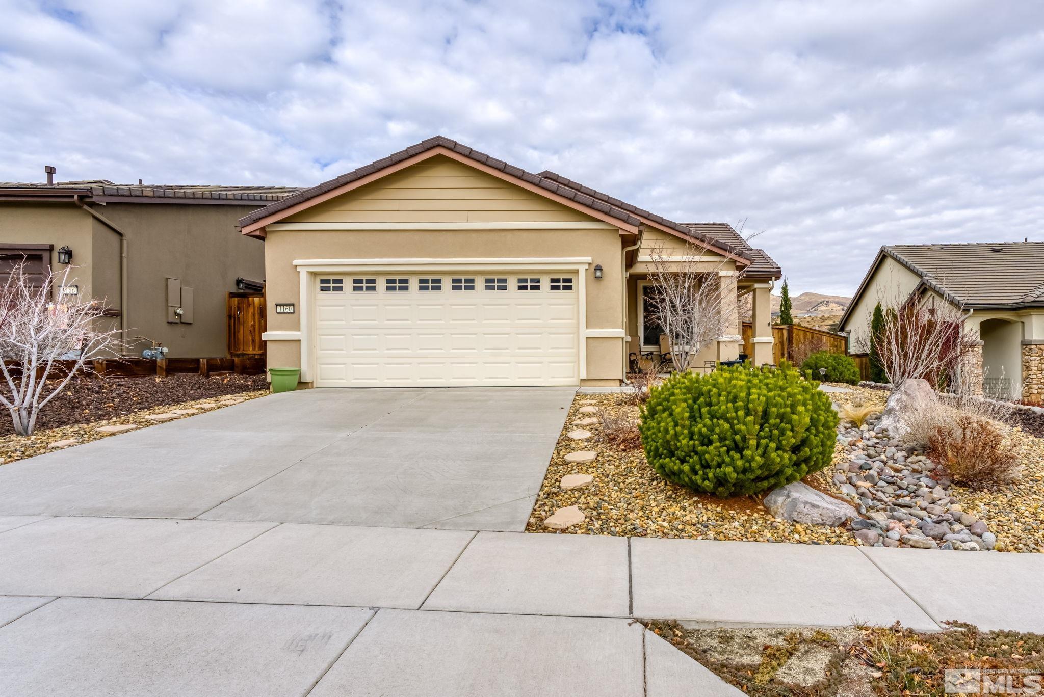 1160 Callaway Trail Reno, NV 89523 - Photo 3 of 40 a view of a house with a yard and potted plants